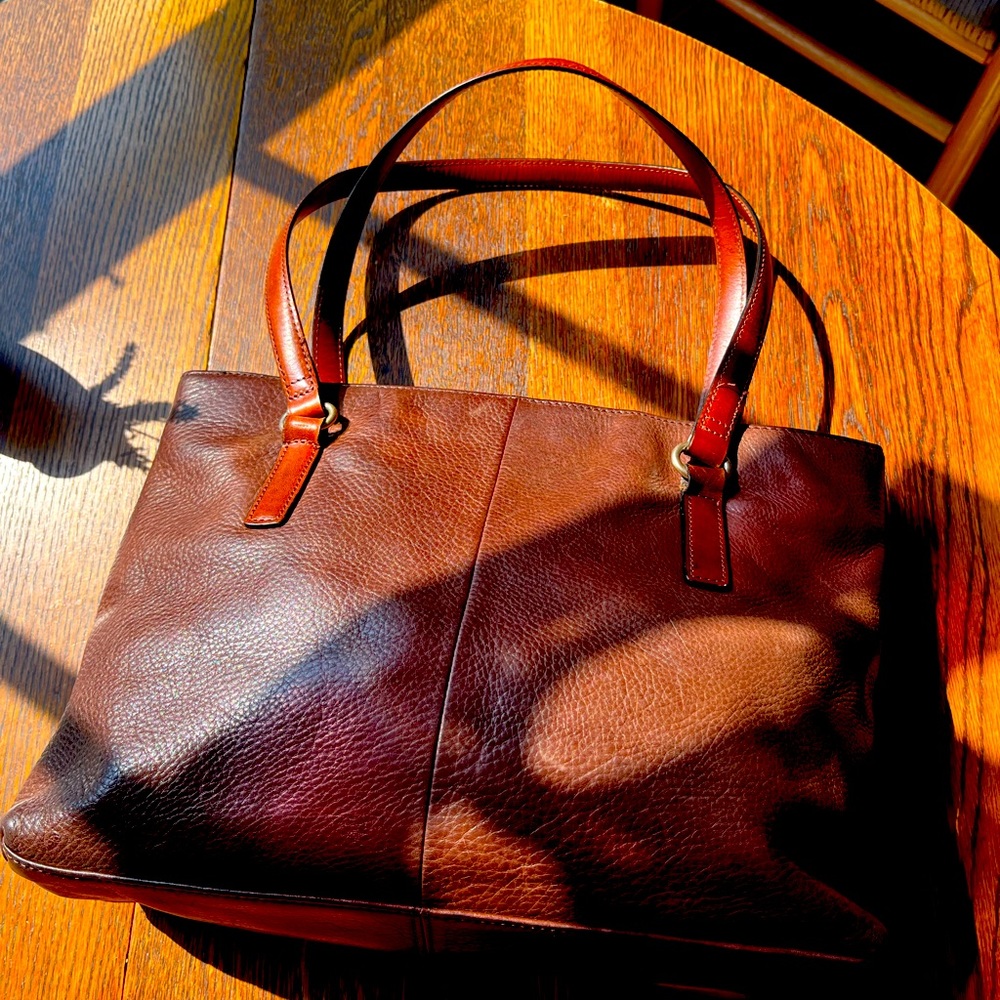 Fossil pebbled brown handbag.